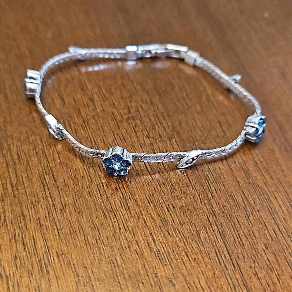 Three silver-toned bracelets - at least one is sterling silver - Picture 4 of 5
